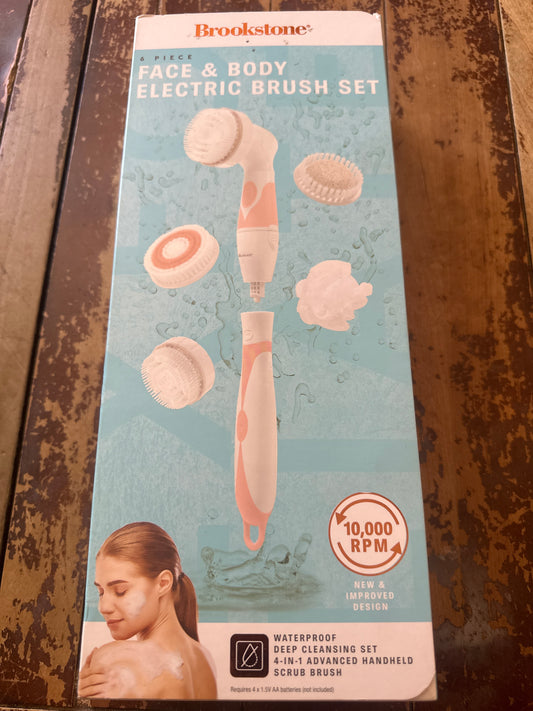 Brookstone face and body electric brush set